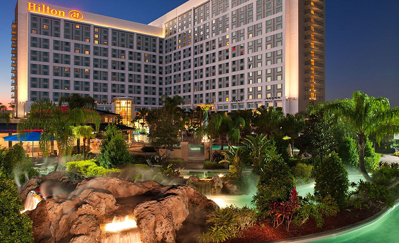 exterior_lg_with-lazy-river-night (2) Hilton Hotel Orlando Exterior
